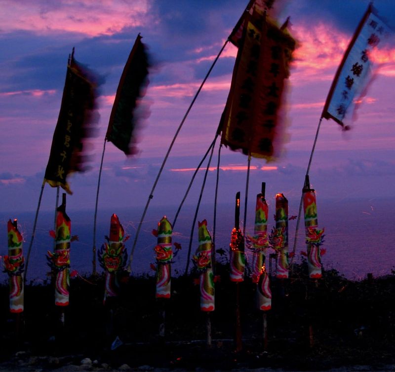 Flags flying at sunset at South Point Temple.